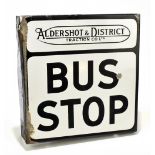 An original double-sided enamelled sign 'Aldershot & District Traction Co Ltd' bus stop sign, with