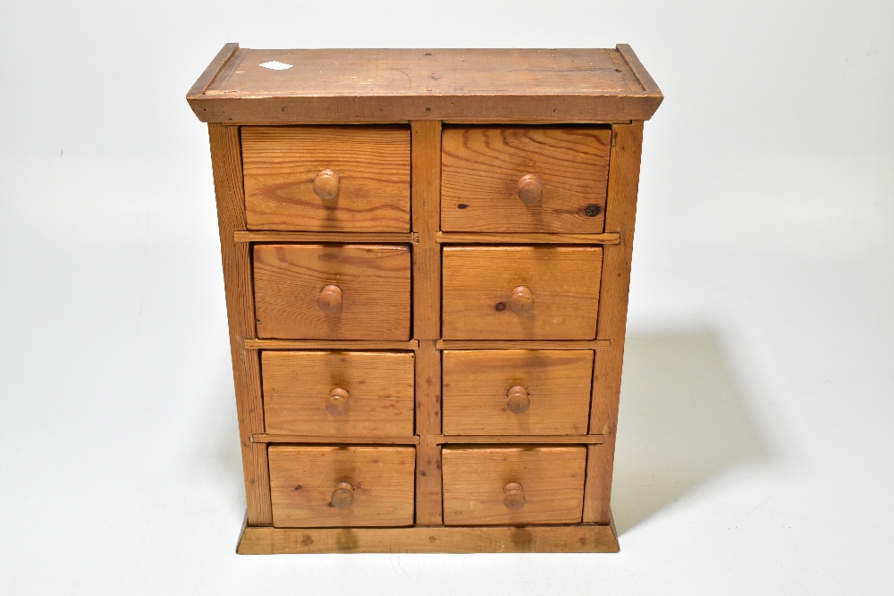 A pine miniature chest of eight drawers, raised on plinth base, width 33.5cm, height 40.5cm, depth - Bild 2 aus 6