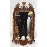 A reproduction mahogany fretwork and gilt mirror, 112 x 60cm.Additional InformationSome splits,