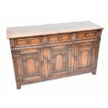 TITCHMARSH & GOODWIN; an oak sideboard/dresser base with three short drawers above three cupboard