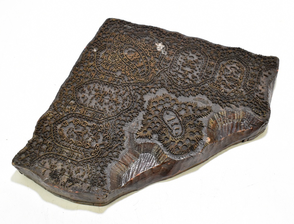 A vintage wood and brass printing block of a corner detail, width 43cm.Additional InformationSome