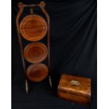 An Edwardian line inlaid mahogany folding cake stand and a walnut sewing box (2).Additional