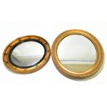 A 19th century gilt framed oval wall mirror with moulded detail, 58.5 x 52cm, together with a