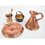 A group of copper and brassware including a mortar and pestle, jug, etc.