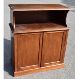 An early 20th century mahogany cupboard, with fixed shelf above a pair of panelled cupboard doors,