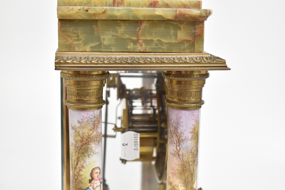 MARTI ET CIE; a late 19th century French onyx, gilt metal and porcelain mantel clock garniture, - Image 7 of 12