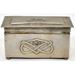 An Arts & Crafts pewter box with overhanging lid inset with an oval shell panel, with initials 'R.C.