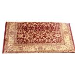 A Ziegler hand knotted 100% wool carpet, central burgundy panel with pale caramel floral,