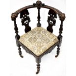 A 19th century carved walnut corner chair,