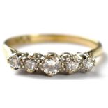 An 18ct yellow gold and platinum five graduated stone diamond ring, size O1/2,