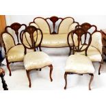 An Edwardian five-piece inlaid mahogany parlour/salon suite comprising a two-seater settee,