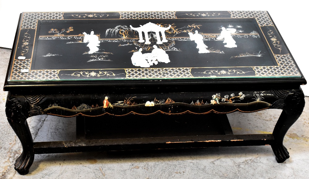 An early 20th century Oriental black lacquer coffee table,