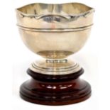 An Edward VII hallmarked silver pedestal bowl with wavy edge and repoussé central band,