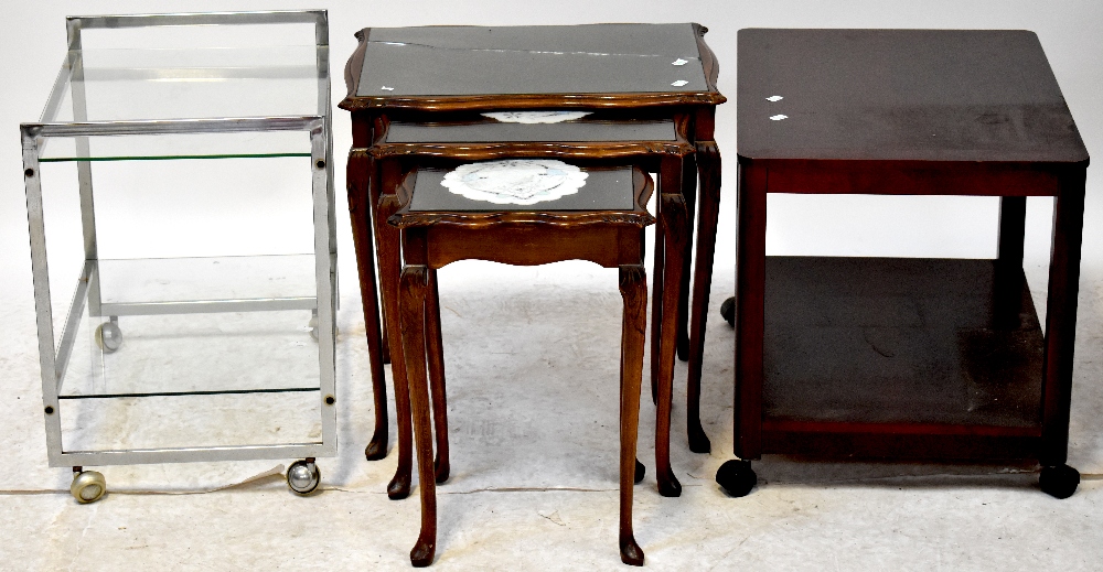 A nest of three mahogany tables on slender tapering cabriole supports to pad feet,