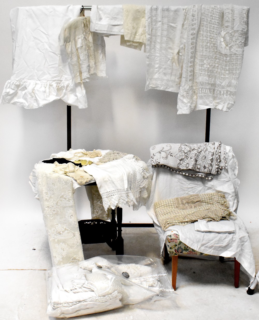 A large quantity of early/mid-20th century linen, lace and crochet work to include bed throws,