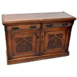 A Victorian mahogany sideboard, two curved drawers over two carved panel doors, to plinth base,