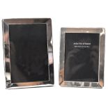 Two matching sterling silver photograph frames of varying sizes, the largest 18 x 13cm (2).