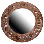 A Keswick School of Industrial Arts and Crafts copper mirror with circular bevelled edge central