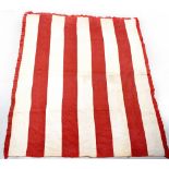 An early 20th century Welsh/Durham quilt, each side with ivory and deep red stripes, 218 x 187cm.