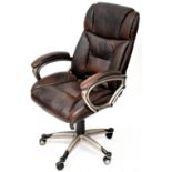 A contemporary brown leather adjustable office chair on outswept quadripartite supports and castors.