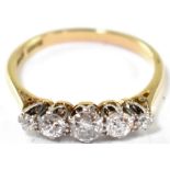 An 18ct gold five stone diamond ring, the claw set diamonds approx. 0.25ct, 2x 0.1ct and 2x 0.