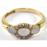 An 18ct gold diamond and opal cluster ring,