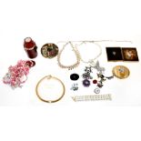 Various items of costume jewellery to include an early 19th century red gemstone brooch with