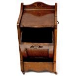 A Victorian oak purdonium with three-quarter gallery top, shaped front above fall front,