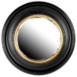 A contemporary ebonised circular wall mirror with gilt slip, diameter 68cm.