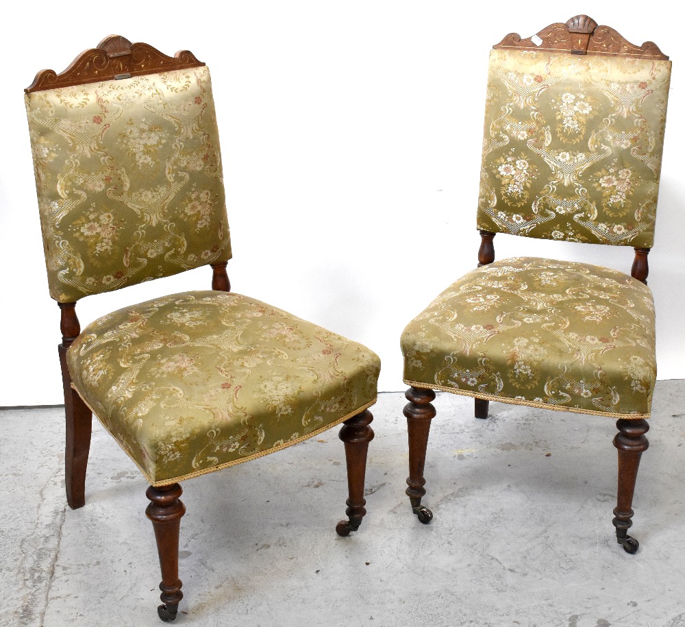 A set of four 19th century oak dining chairs, carved top rail to overstuffed seat,