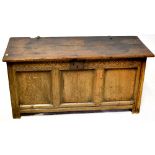 An 18th century and later oak coffer, three-panel front with iron lock,