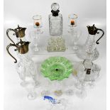 A large quantity of cut and pressed glass to include three claret jugs with silver plated mounts,