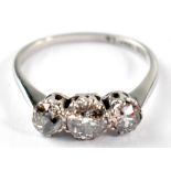 An 18ct white gold trilogy diamond ring, central stone approx 0.5ct, size L, approx 2.2g.