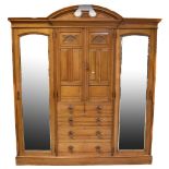 A satinwood triple wardrobe,