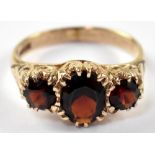 A 19th century style 9ct gold and garnet three-stone ring,