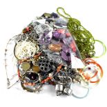 A quantity of costume jewellery to include necklaces, etc.