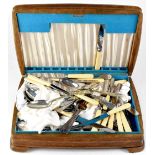 An oak-cased canteen containing various silver-plated cutlery.