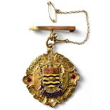 A 9ct yellow gold enamelled and jewelled medal,