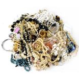 A quantity of costume jewellery to include faux pearl necklaces, etc.