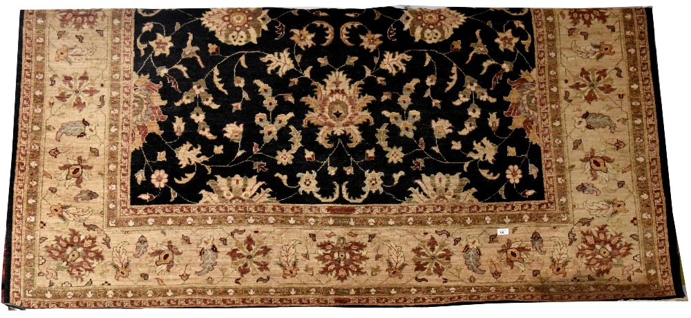 A large Farhan hand knotted wool rug,