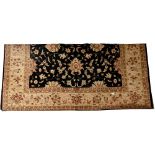 A large Farhan hand knotted wool rug,