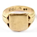 A gentleman's vintage 18ct gold signet ring with blank shield head, size T, approx. 7.4g.