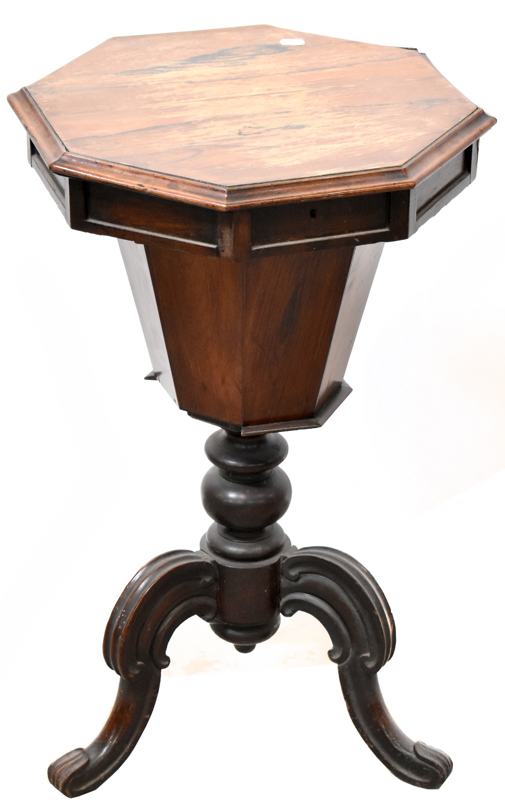 A 19th century mahogany octagonal sewing box with lift-out tray and interior check lining,