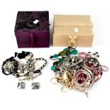 A quantity of costume jewellery contained within two jewellery boxes to include necklaces, bangles,