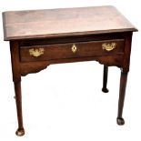 An early 19th century side table, one long central drawer to column and hoof supports,