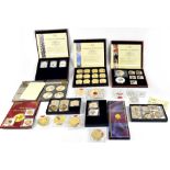 Various collectible coins and coin packs, predominantly Windsor Mint,