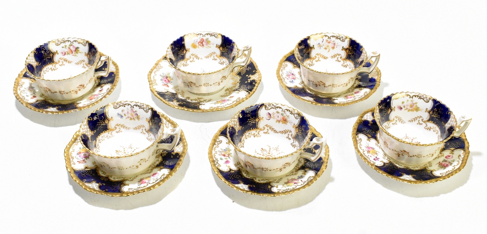 COALPORT; six blue 'Batwing' pattern teacups and five saucers, together with a slightly larger