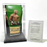 FLOYD MAYWEATHER JR; an autographed left handed boxing glove, fitted in perspex case with stand,