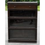 MEOVOTO; an early 20th century stained oak Globe Wernicke style bookcase with drawer above three