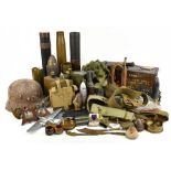 A mixed group of militaria including WWI and later shell casings, a copper and brass bugle, Trench